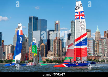 New York, USA. 22nd June, 2019. SailGP F50 catamarans of teams France, Australia and Great Britain sail in the Hudson river in front of the lower Manhattan skyline during the SailGP New York event. Credit: Enrique Shore/Alamy Live News Stock Photo