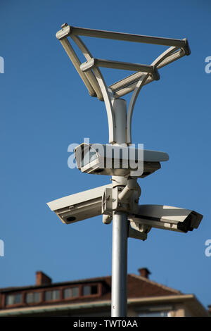 Security camera record live, Security camera on blue sky background. Stock Photo