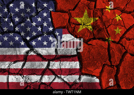 Trade war between United states of america VS China . flag on cracked wall background . Confliction and crisis concept . Stock Photo