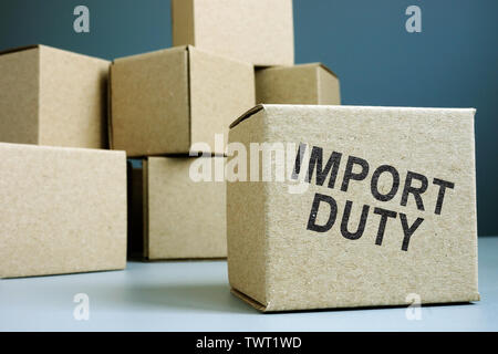 Import duty concept. Pile of cardboard boxes. Stock Photo