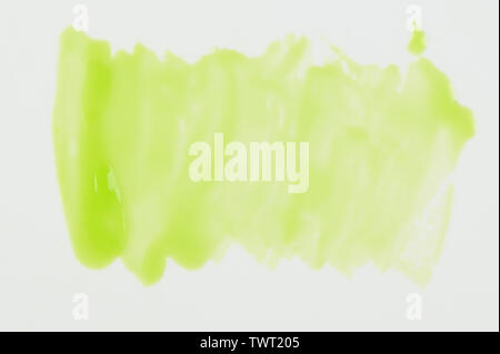 Transparent green paint stain isolated on white background close up view Stock Photo