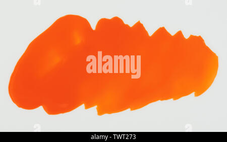 Orange paint stain isolated on white background close up view Stock Photo