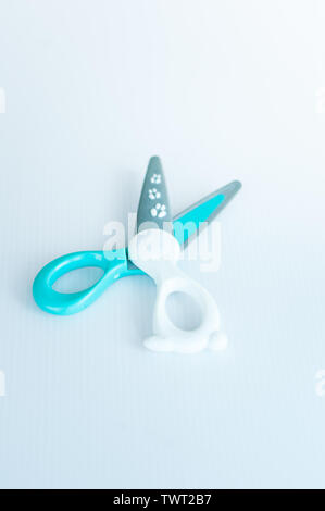 children's colourful safe scissors on a white background. scissors made of plastics to avoid injuries. Stock Photo