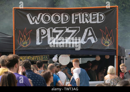 People queueing for Wood Fired Pizza, at music event in Sefton Park, Liverpool, UK Stock Photo