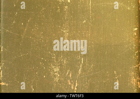 Old shabby green background with a golden shade, grid pattern, scratches. Vintage canvas texture of old book cover. Stock Photo