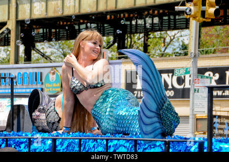 Lady dressed in a mermaid costume during the Event.The 37th Annual Mermaid Parade was held at Coney Island, in New York City.  It is the largest art parade in the USA and one of New York City's greatest summer events. Stock Photo