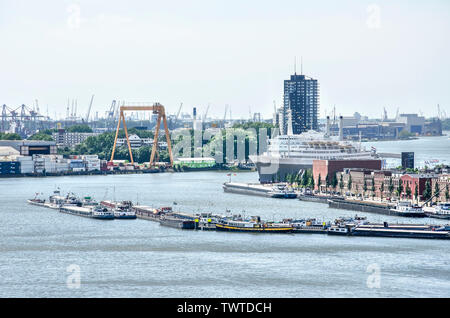 Rotterdam, The Netherlands, June 2, 2019: View across Maashaven harbour towards the tip of Katendrecht peninsula with SS Rotterdam former cruiseship a Stock Photo