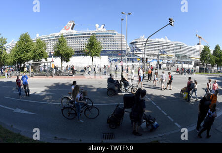Kiel, Germany. 22nd June, 2019. The cruise ships 'Mein Schiff 4' (l-r) and 'Aida Prima' will be moored at the Ostseekai on the first day of Kiel Week. Around three million visitors are expected at the sailing and party event on the fjord. (shot with ultra wide angle lens) Credit: Carsten Rehder/dpa/Alamy Live News Stock Photo
