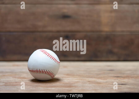 baseball on Abstract background and red stitching baseball. White baseball with red thread.Baseball is a national sport of Japan. It is popular. Stock Photo