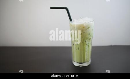 A glass of iced green tea latte