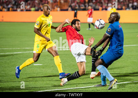 CAIRO, EGYPT - JUNE 21: Marwan Mohsen Fahmy Tarwat of Egypt challenge Edmore Sibanda of Zimbabwe duing the 2019 Africa Cup of Nations Group A match between Egypt and Zimbabwe at Cairo International Stadium on June 21, 2019 in Cairo, Egypt. (Photo by Sebastian Frej/MB Media) Stock Photo