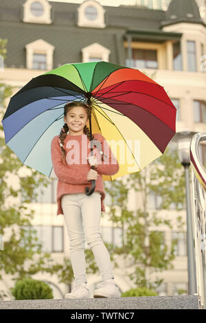 Colorful accessory positive influence. Bright umbrella. Stay positive and optimistic. Everything better with my umbrella. Colorful accessory for cheerful mood. Girl child long hair with umbrella. Stock Photo