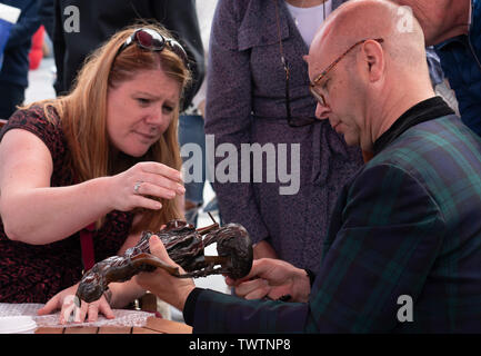 Dundee, Scotland, UK. 23 June 2019. The BBC Antiques Roadshow TV programme is aiming on location t the new V&A Museum in Dundee today. Long queues formed as members of the public arrived with their collectables to have them appraised and valued by the Antiques Roadshow experts. Select items and their owners were chosen to be filmed for the show. Credit: Iain Masterton/Alamy Live News Stock Photo