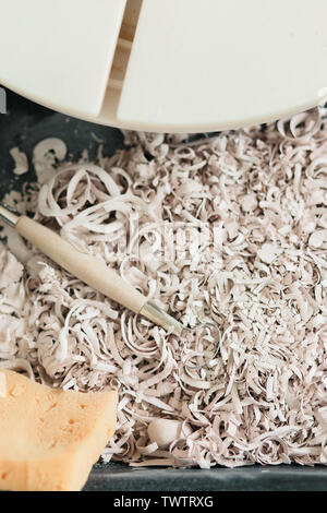 pottery tools for carving ceramic products in workshop Stock Photo