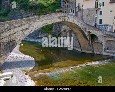 Medieval stone bridge over Nervia river, Dolceacqua, province Imperia, Riviera di Ponente, Liguria, Italy Stock Photo