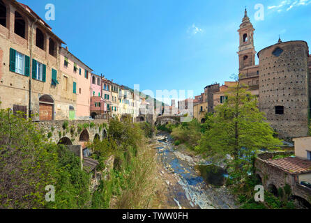 The medieval village Dolcedo with stone bridge Ponte Grande and church San Tommaso, province Imperia, Liguria, Italy Stock Photo