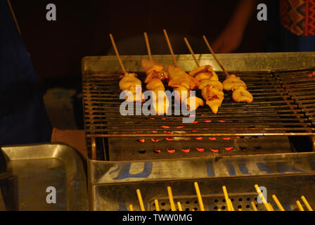 Squid marinated in the side dishes of the shop, placed on the tray, ready for sale and grill service, waiting for customers to choose Stock Photo