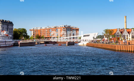 GDANSK, POLAND - June 22, 2019: The footbridge over Motlawa river in Gdansk connecting the main town with the Olowianka island. Poland. Stock Photo