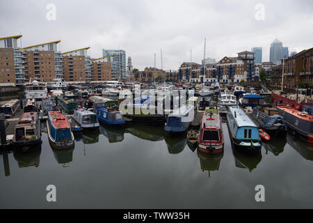 LONDON, UK - JUN 11 2019: Boats for living on Millwall dock in the center of Isle of Dogs Stock Photo