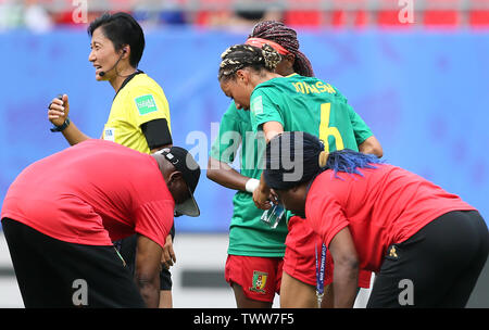 Cameroon's Estelle Johnson (centre) receives treatment during the FIFA Women's World Cup, round of Sixteen match at State du Hainaut, Valenciennes. Stock Photo