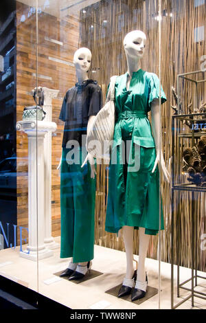 Belgrade, Serbia - June 19, 2019: Mannequin dolls in spring outfit displayed n the shop window of Max Mara clothing expensive and elegant brand Stock Photo