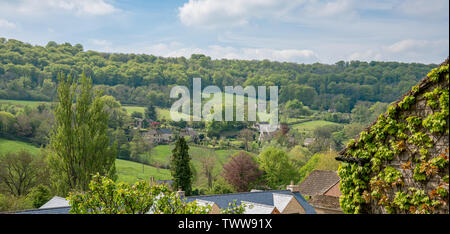 View across Sheepscombe with village church, St John the Apostle, The Cotswolds, Gloucestershire, United Kingdom Stock Photo