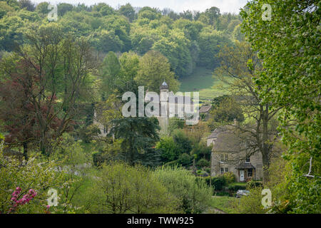 View across Sheepscombe with village church, St John the Apostle, The Cotswolds, Gloucestershire, United Kingdom Stock Photo