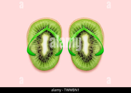 Kiwi Flip flops on pastel pink background Summer concept flat lay minimal Stock Photo