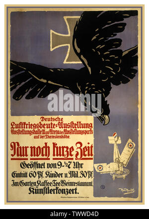 Vintage German WW1 Propaganda “Now for a short time only, an exhibition of spoils from the air war campaign” .WW1 German Poster shows a black eagle diving after a bullet-ridden, badly damaged British biplane which is plunging to earth. 1915 Germany Stock Photo