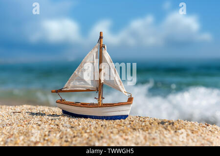 a toy boat on the sand in the desert 35193082 Stock Photo at Vecteezy