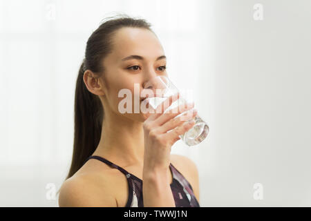 Healthy Lifestyle. Young Woman Drinking Fresh Water