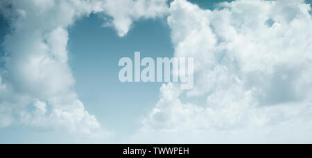 White heart-shaped clouds on a blue sky background Stock Photo