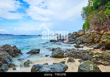 Watch the Andaman sea from the rocky coast of Khai Nok island, Phuket, Thailand Stock Photo