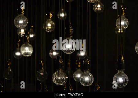Lighting bulbs on dark background texture background Stock Photo