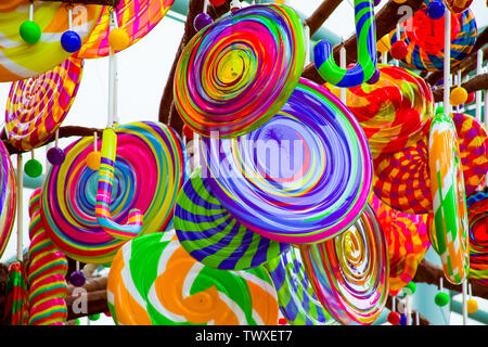 Colorful lollipops and different colored round candy. Top view. Stock Photo