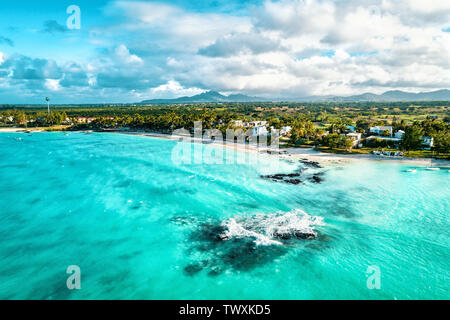 Aerial drone view at luxury resorts and coastline at Belle Mare beach on island Mauritius. Toned image.