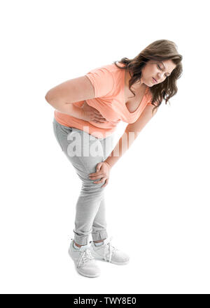 Young woman suffering from flank pain on white background Stock Photo