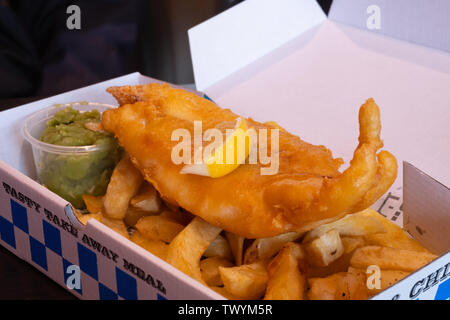 A plate of fish and potato chips in traditional English meal Stock Photo