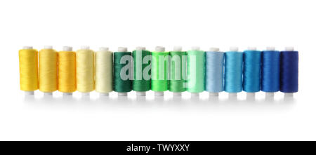 Colorful sewing threads on white background Stock Photo