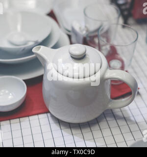 Teapot and various containers Stock Photo