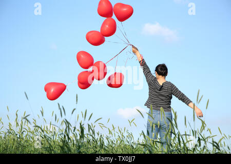 Flying balloon girl hi-res stock photography and images - Alamy