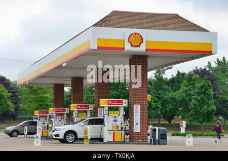 Bartlett, Illinois, USA. Gas pumps on service islands at a modern self-service gas station. Stock Photo