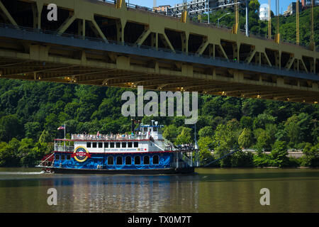 The Queen, a boat in the Gateway Clipper fleet, passes under the Fort Pitt Bridge, near Point State Park, Pittsburgh, Pennsylvania. Stock Photo