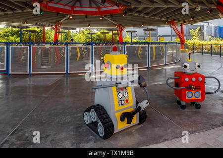 DUBAI, UAE, JANUARY 09, 2019: Beautiful robots made of Lego bricks stand on the background of the carousel Stock Photo