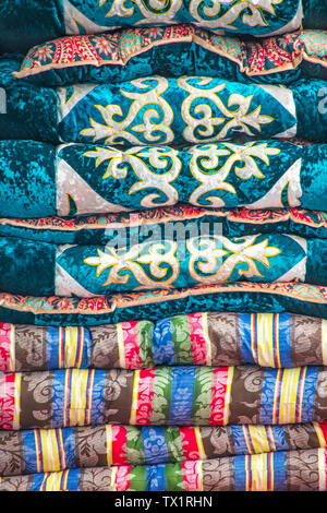 Handmade quilts decorated with national patterns closeup. Market. Travel. Kyrgyzstan Stock Photo