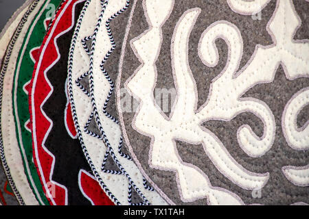 Oriental handmade rugs from felt decorated with national ornament closeup. Market. Travel. Kyrgyzstan Stock Photo