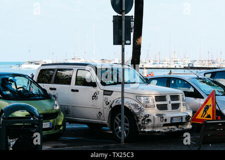 Rapallo, Italy - 03 27 2013: cars on the parking. View of the streets of Rapallo. Stock Photo