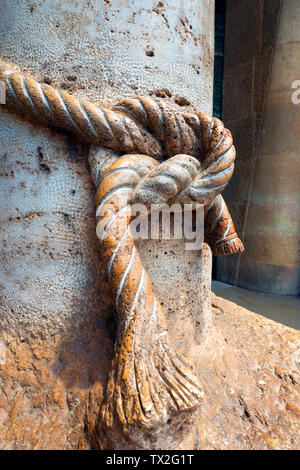 BARCELONA, SPAIN - JUNE 12, 2014: Detail of marble column with knotted rope. Sagrada Familia in Barcelona, Catalonia, Spain. Designed by Antoni Gaudi Stock Photo