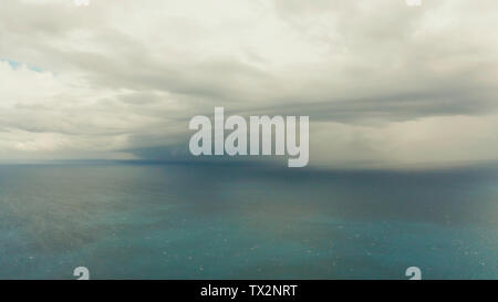 Seascape in cloudy weather, aerial view. Stormy weather over the ocean. Copy space for text. Water cloud horizon background. Stock Photo