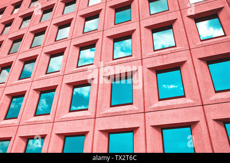 Regular pattern of windows in a colorful building Stock Photo